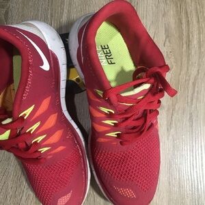 Red and Yellow Nike Free Running Shoes